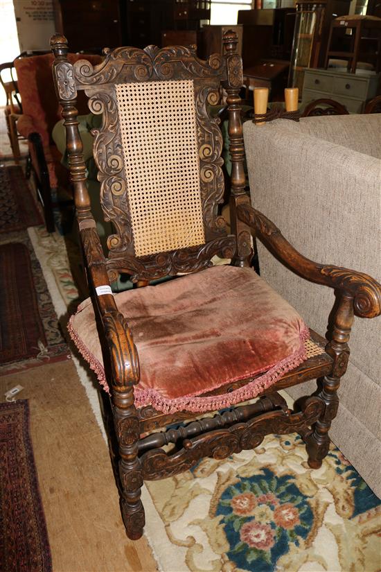 Carolean style carved oak caned seat and back elbow chair